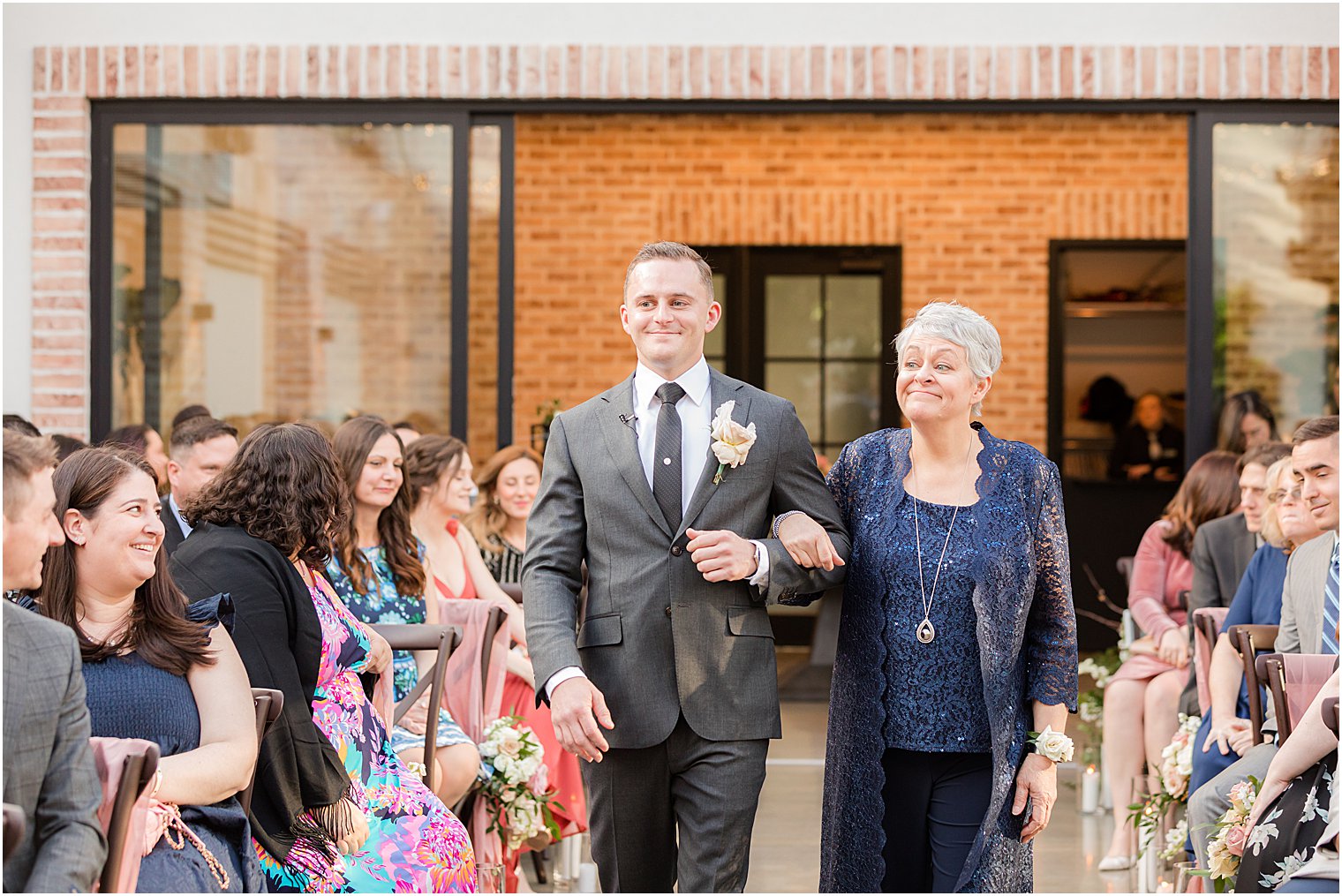 groom walks mother down aisle during NJ wedding ceremony