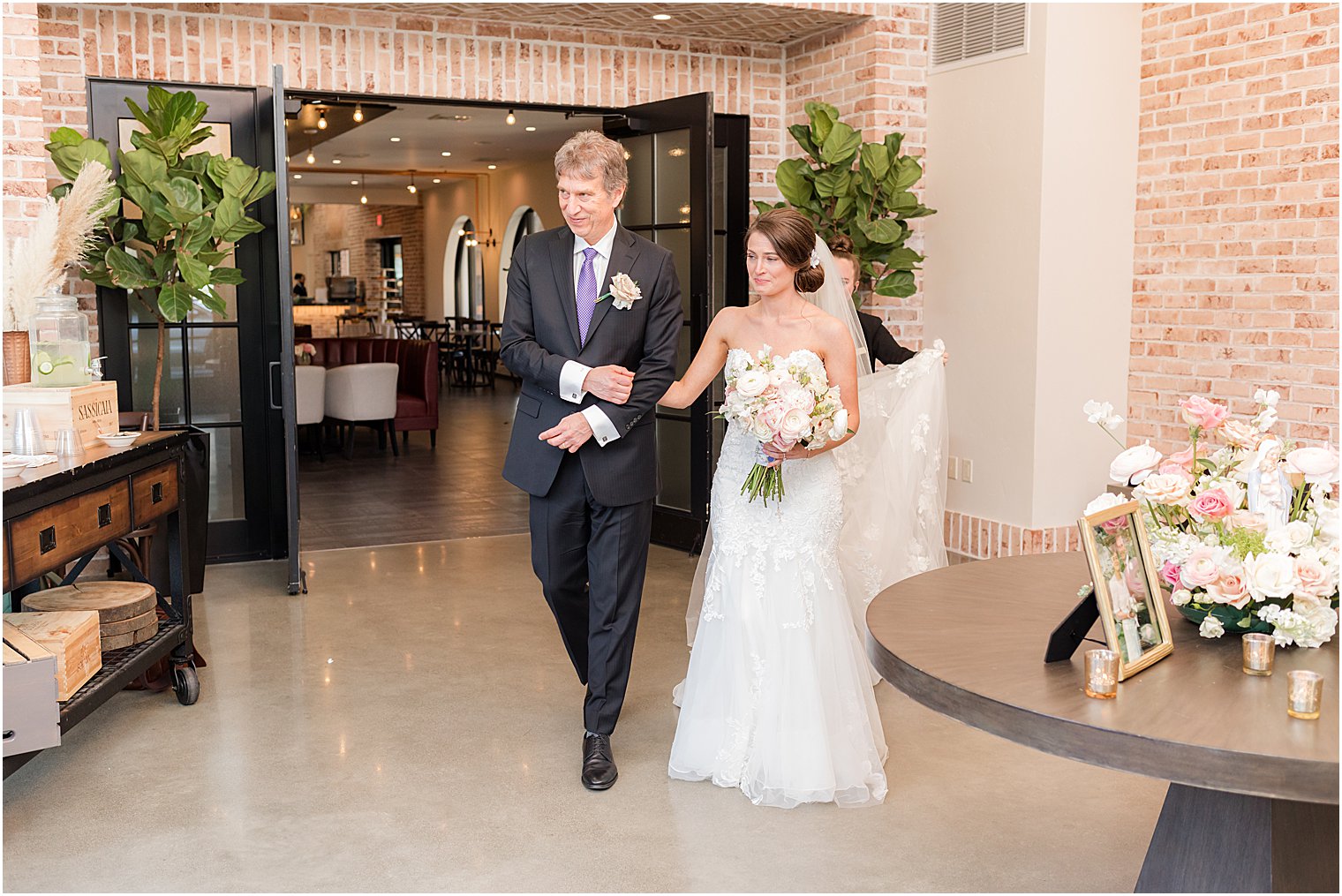 bride enters wedding ceremony with dad