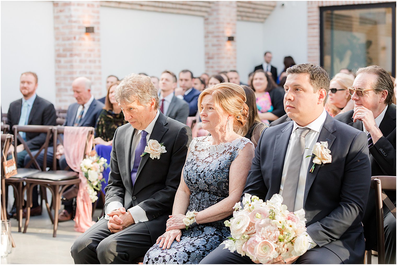 parents watch wedding ceremony