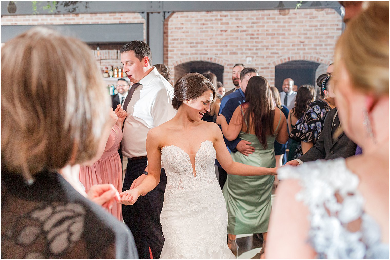 bride dances with guests during NJ wedding reception
