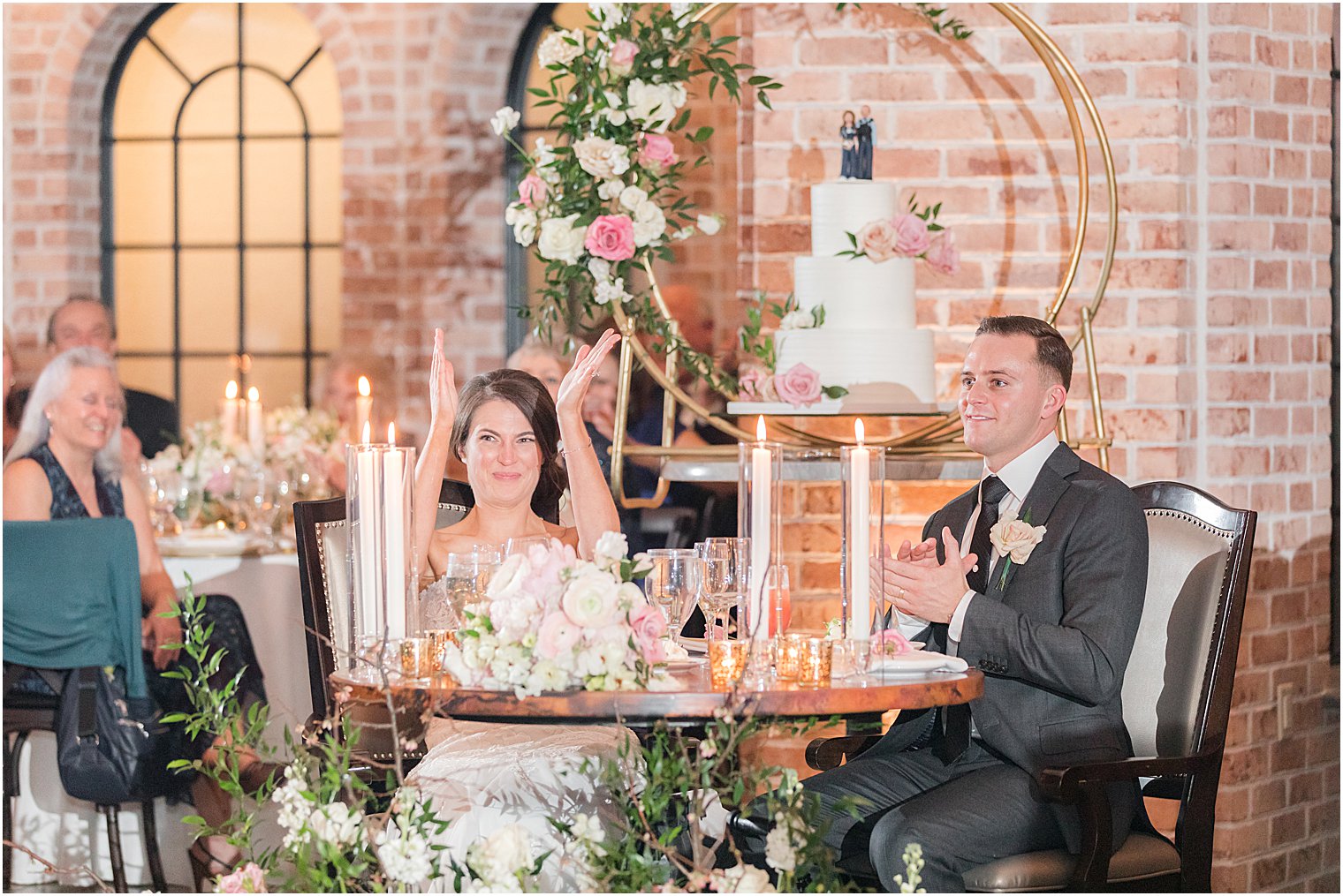 bride and groom listen to toasts during The Refinery at Perona Farms wedding reception