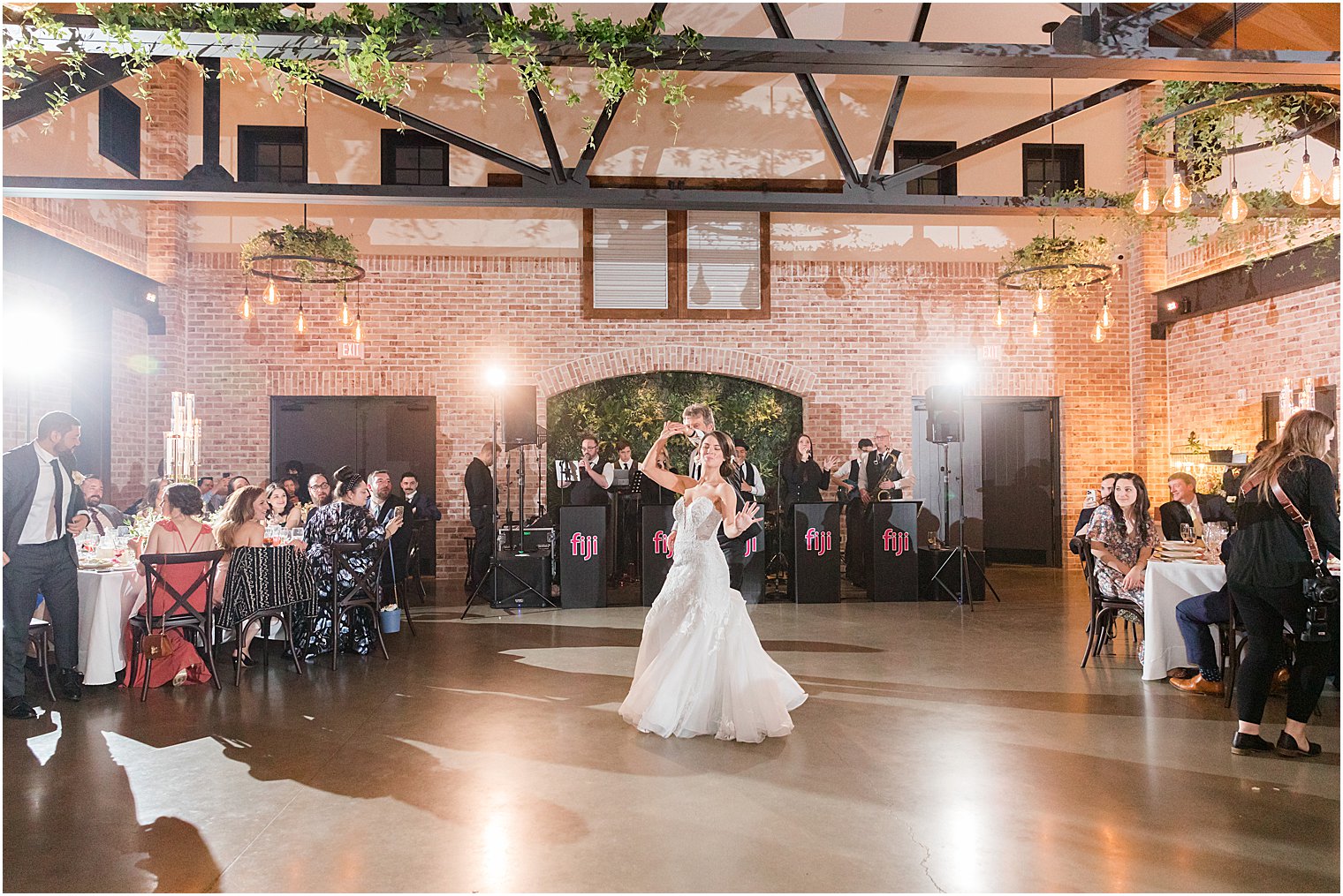 dad dances with bride at The Refinery at Perona Farms