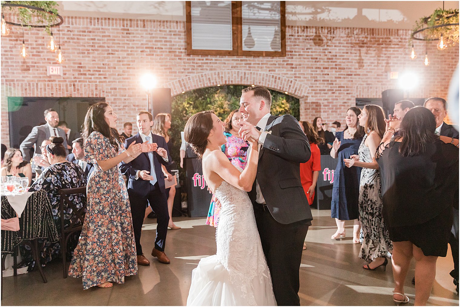 bride and groom dance with guests dance during Andover NJ wedding reception