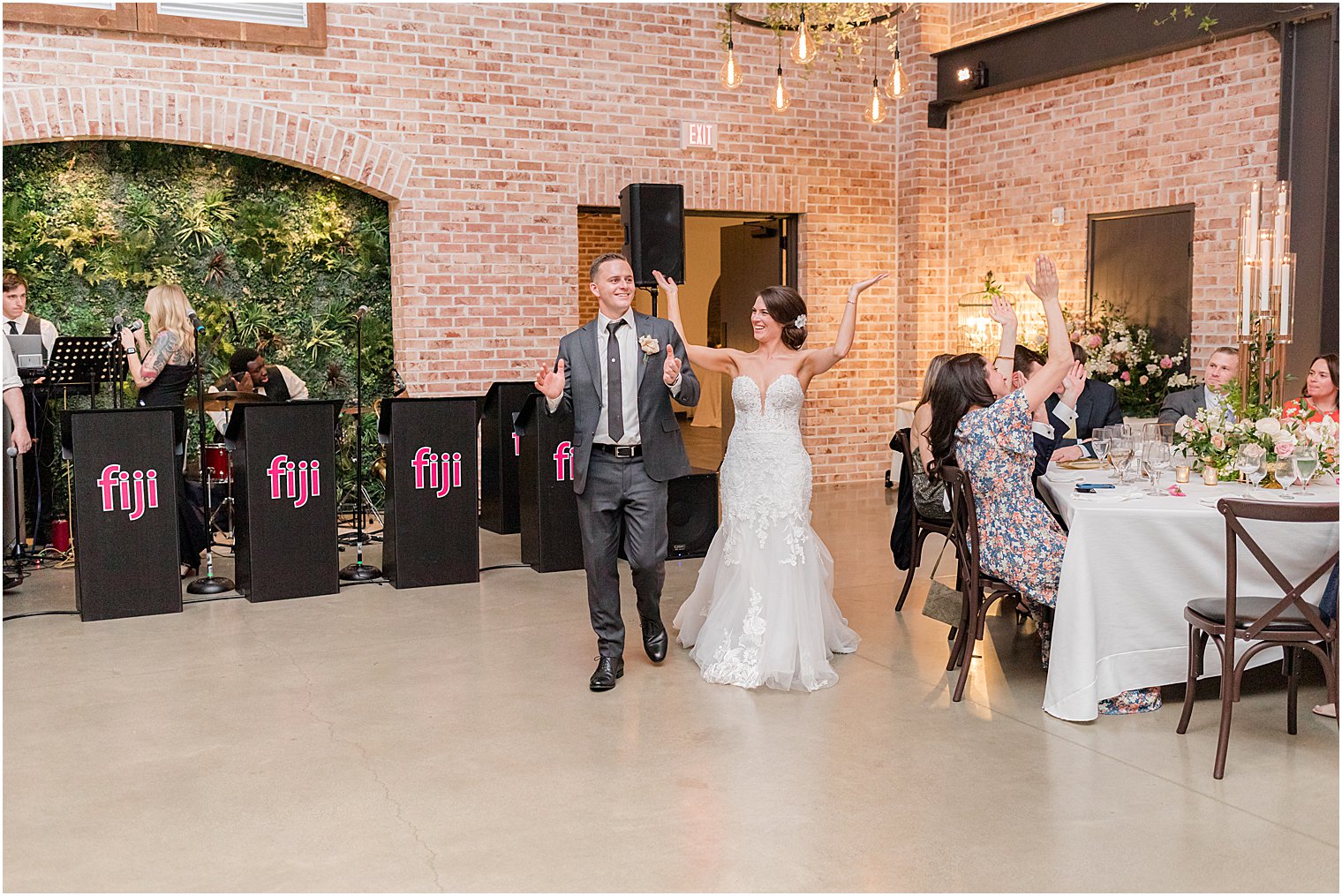 bride and groom enter wedding reception