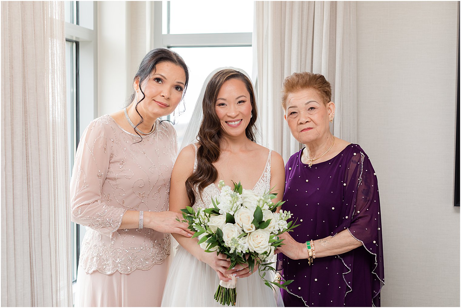 bride poses with mother and grandmother before NJ wedding