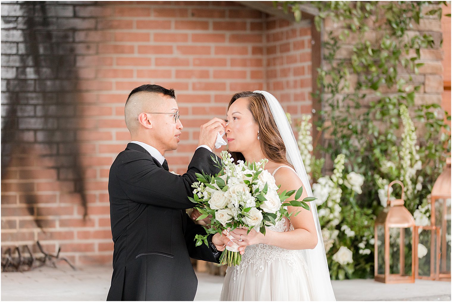 groom wipes bride's tears during first look 