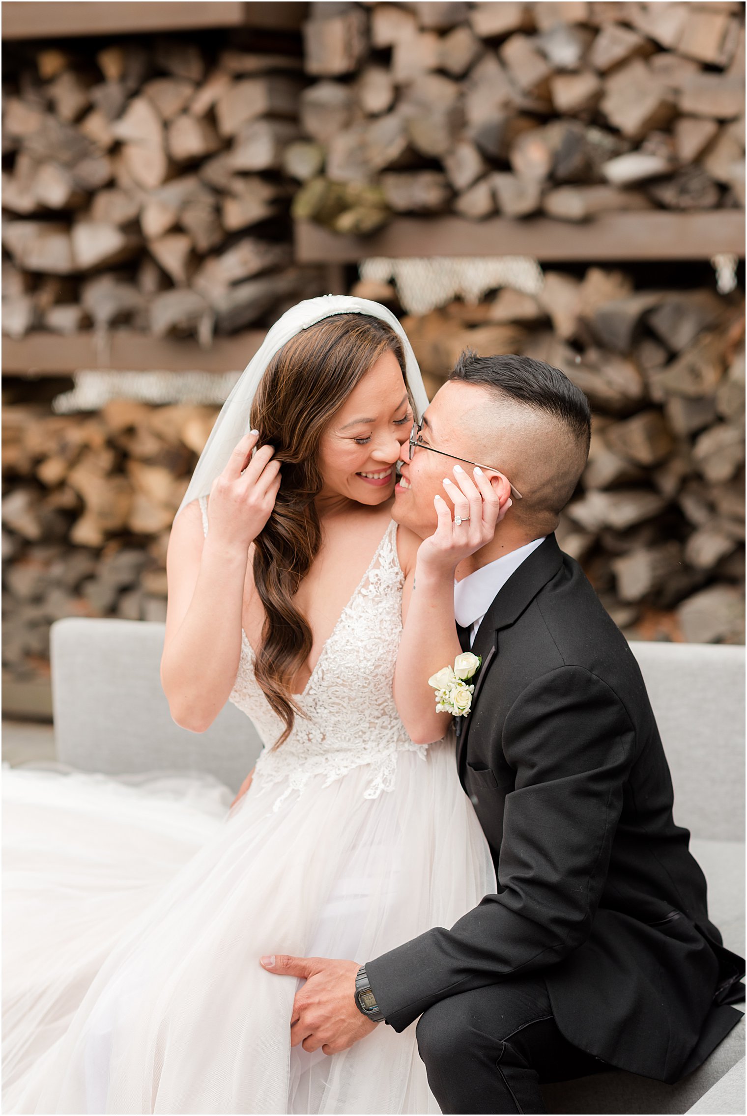bride leans into groom during NJ wedding portraits 