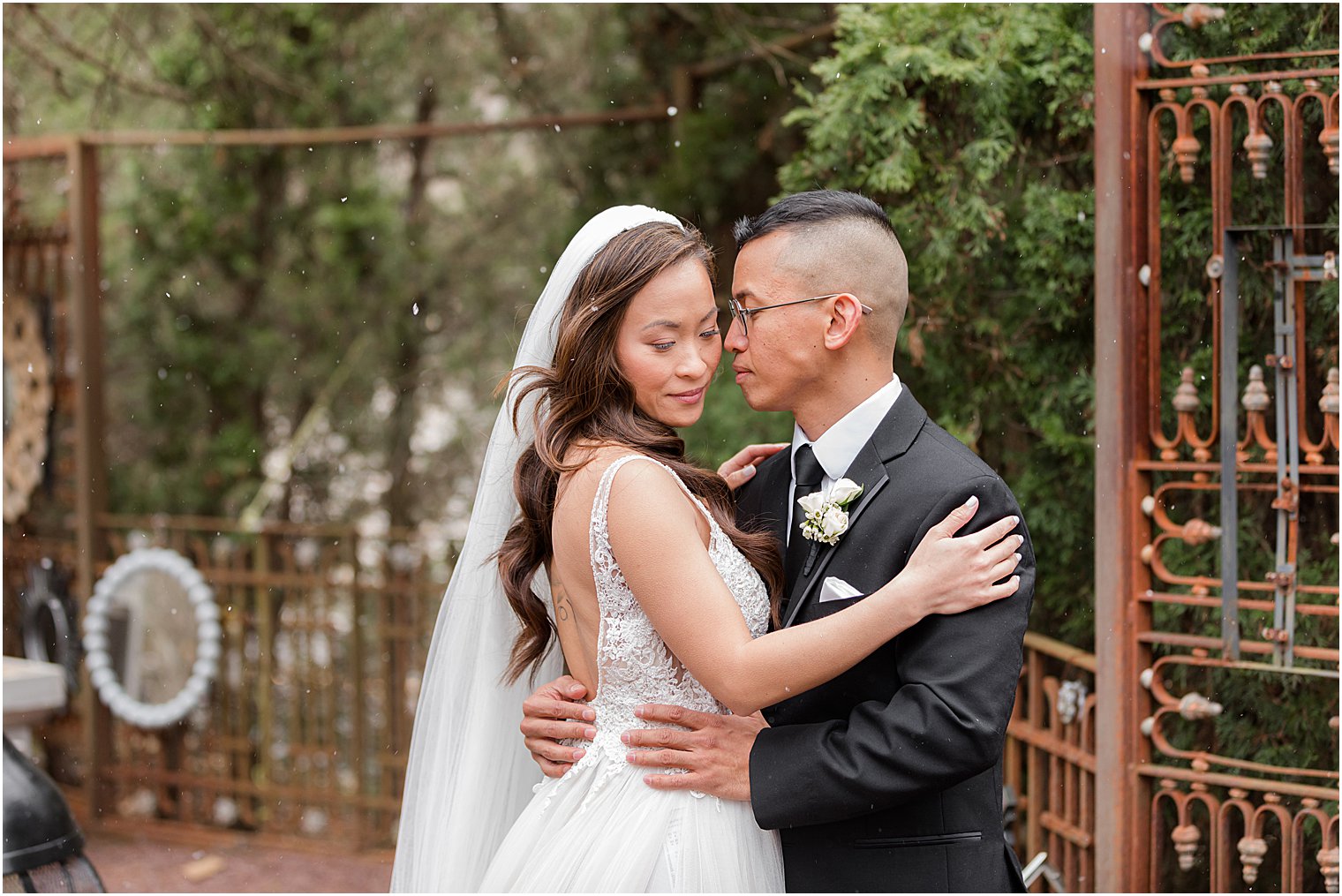 groom hugs bride close during The Lodge at Stirling Ridge wedding portraits 