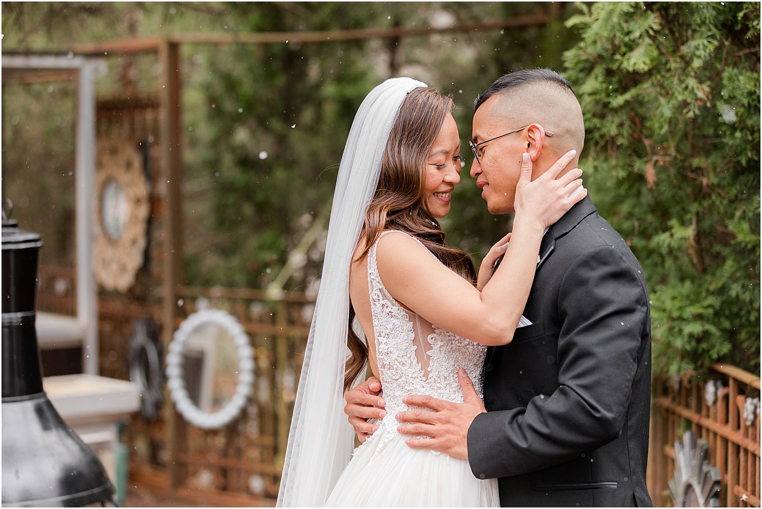 bride and groom hug on patio at The Lodge at Stirling Ridge