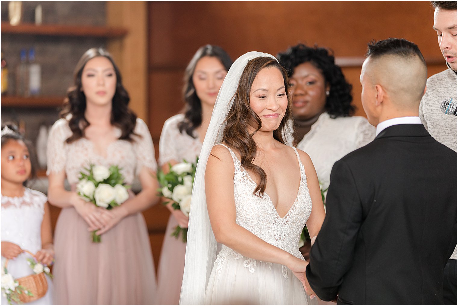 bride smiles during wedding ceremony in New Jersey