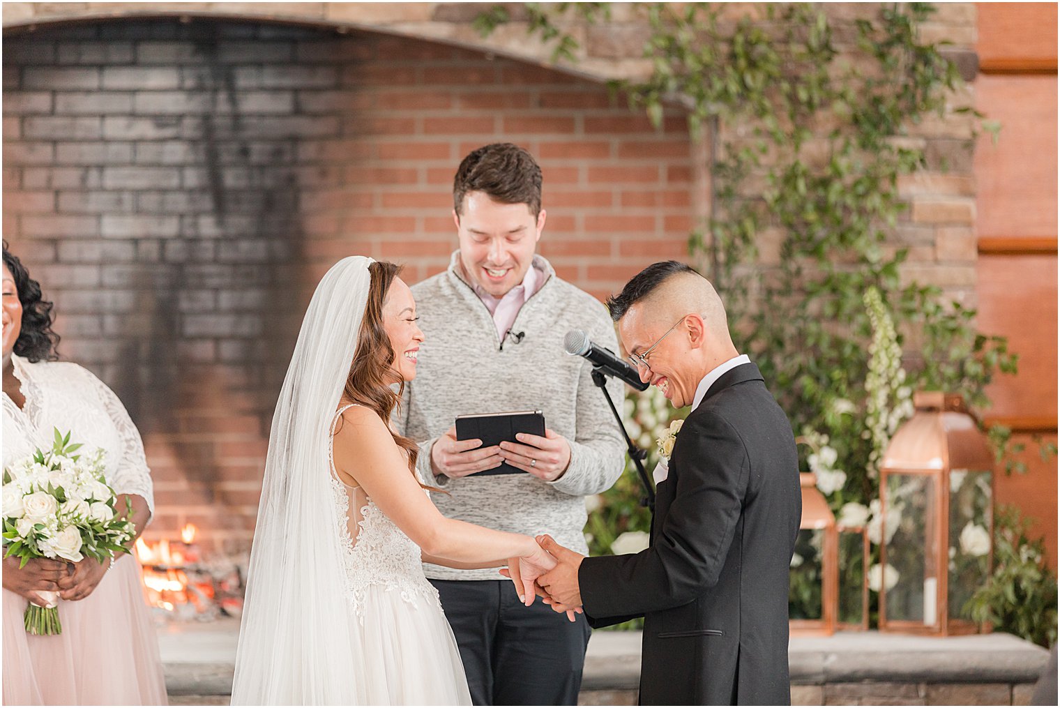 bride and groom laugh during wedding ceremony