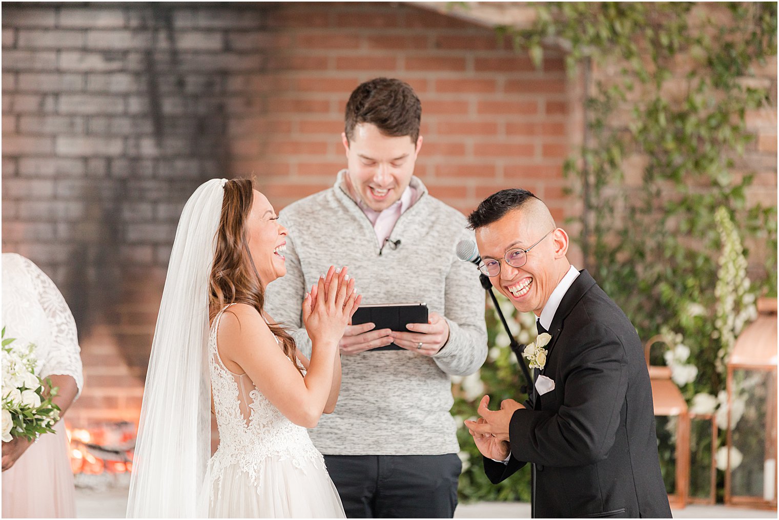 groom laughs during wedding ceremony at The Lodge at Stirling Ridge