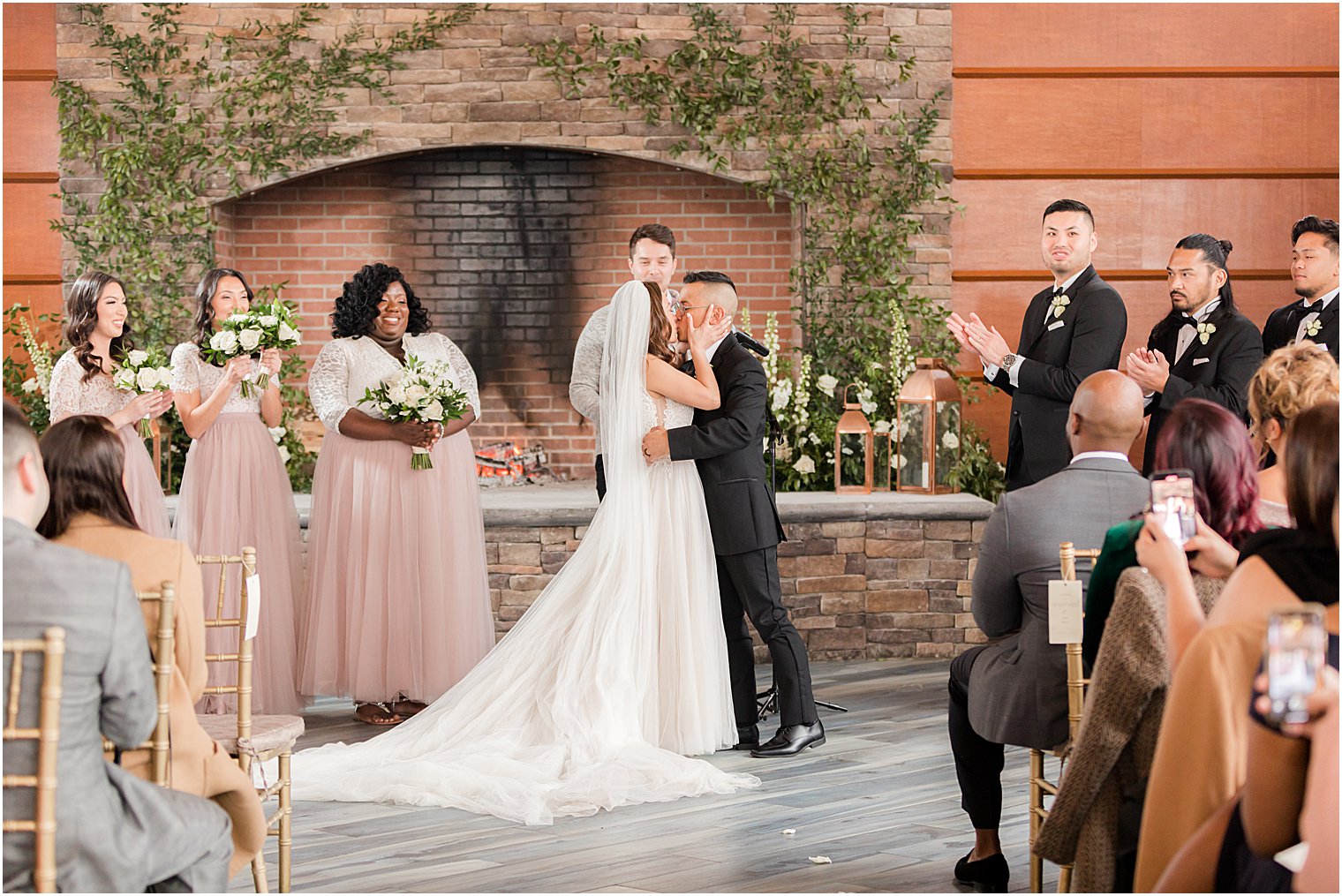 bride and groom kiss during wedding ceremony at The Lodge at Stirling Ridge