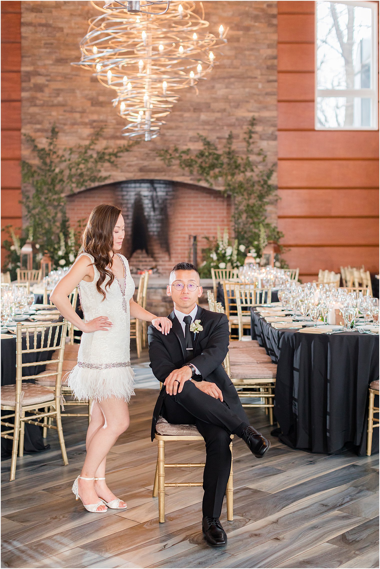 couple poses by tables at The Lodge at Stirling Ridge