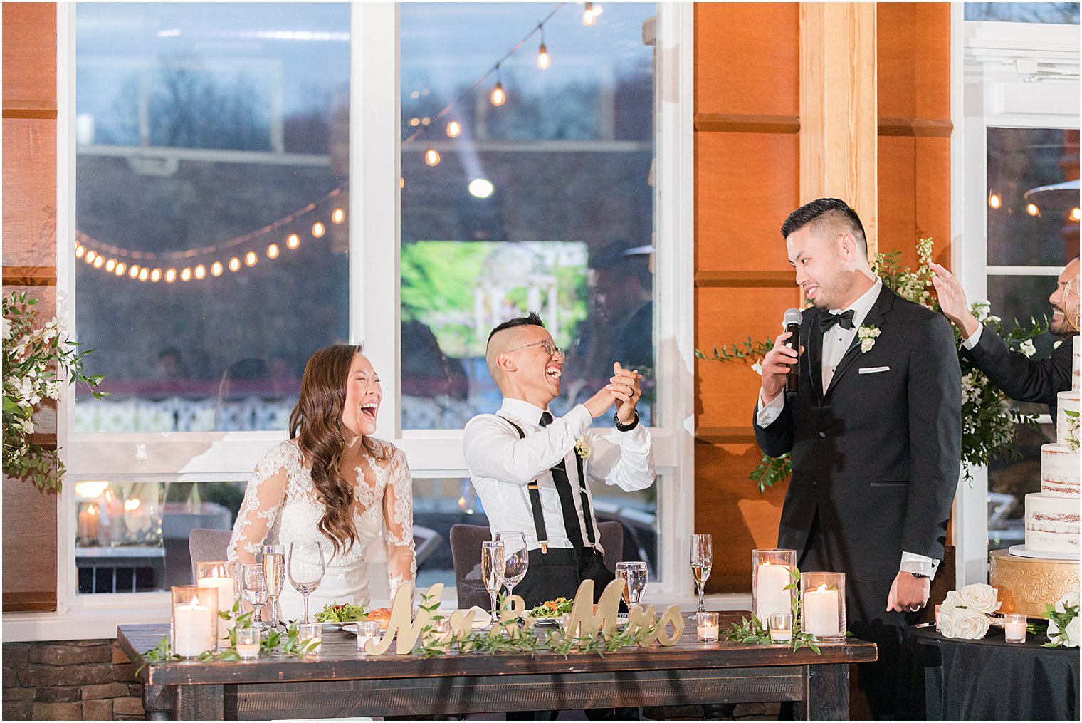 groomsman reads speech to guests
