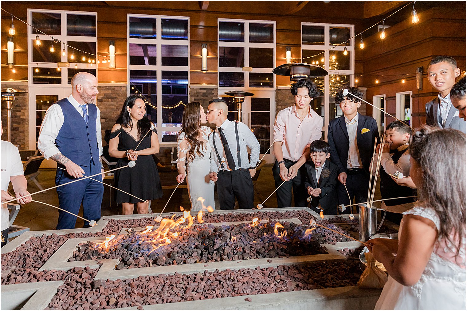 bride and groom roast marshmallows at The Lodge at Stirling Ridge