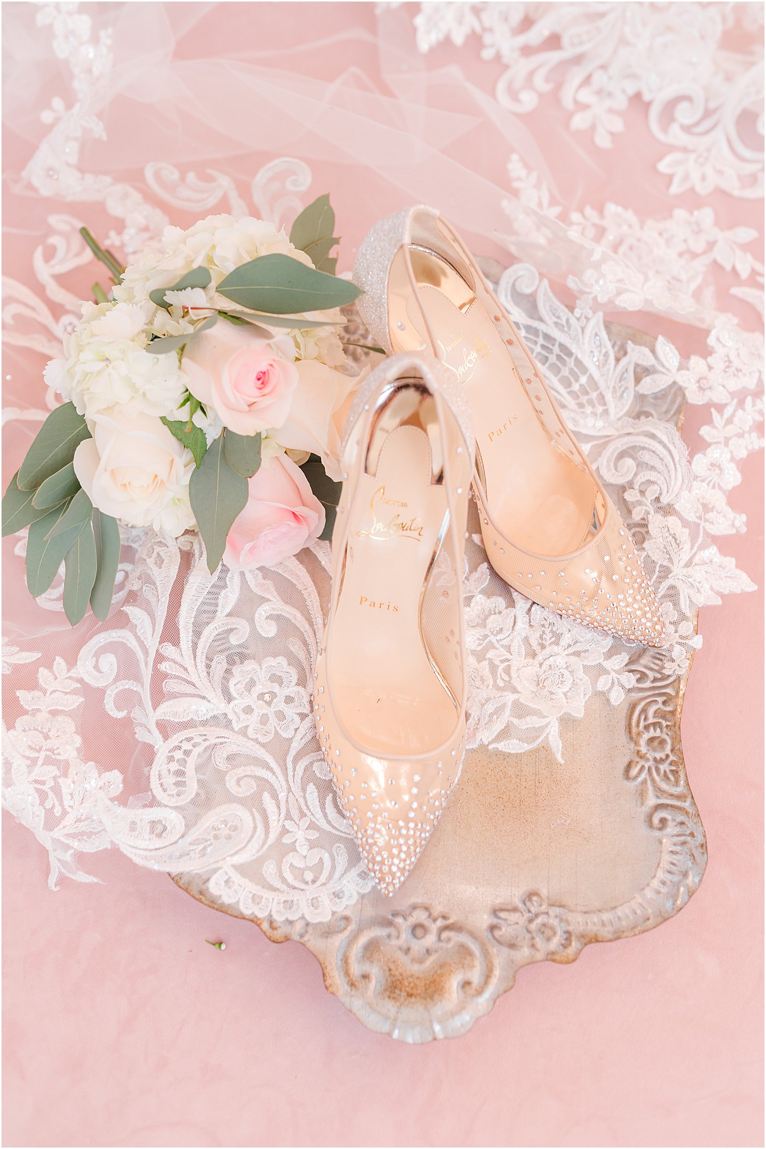 bride's nude heels and bouquet for spring wedding