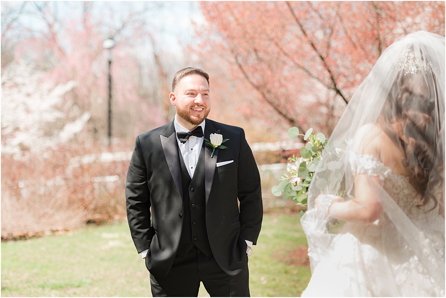 groom sees bride for first time during Newark NJ wedding day first look