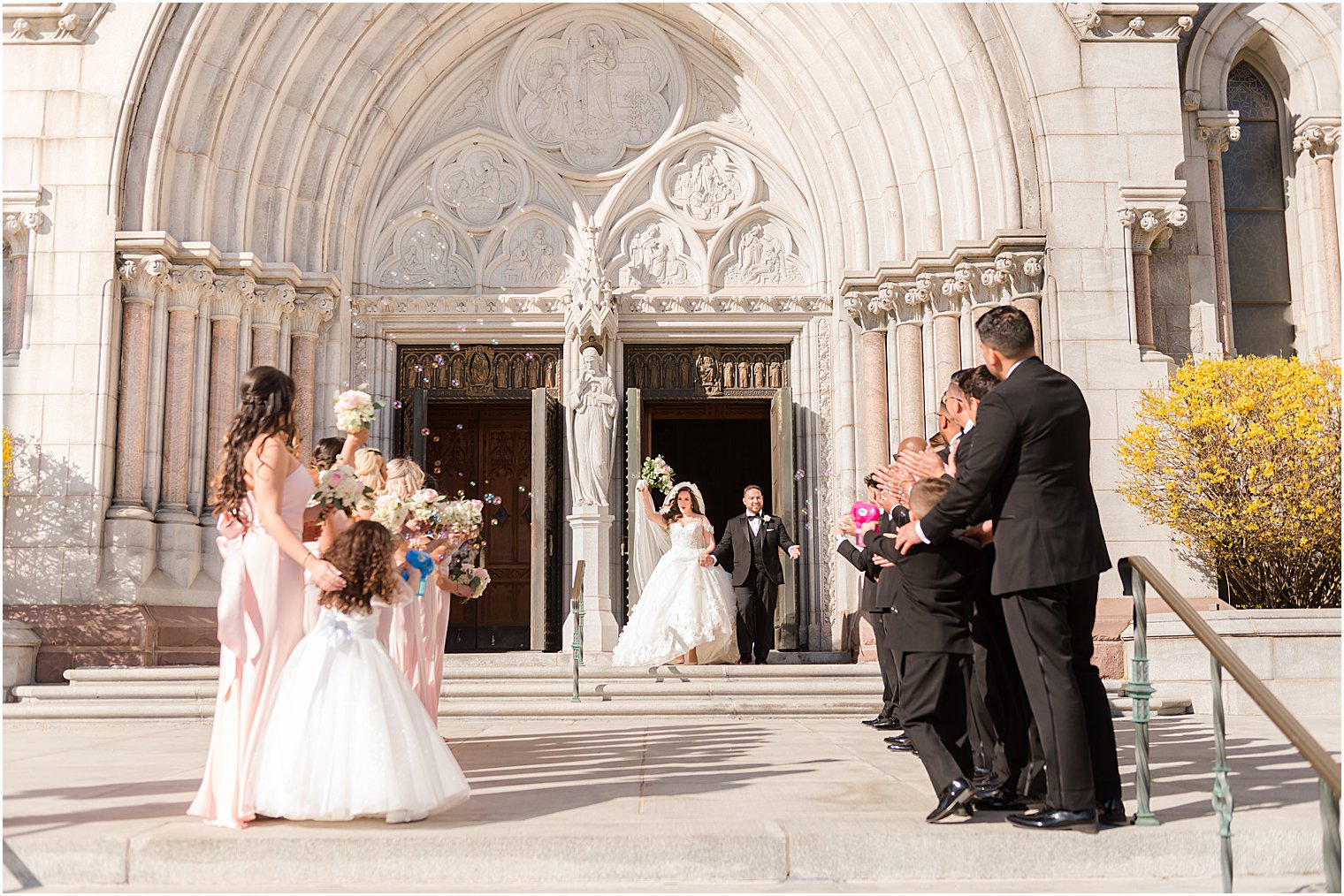 bride and groom leave the Cathedral Basilica of the Sacred Heart