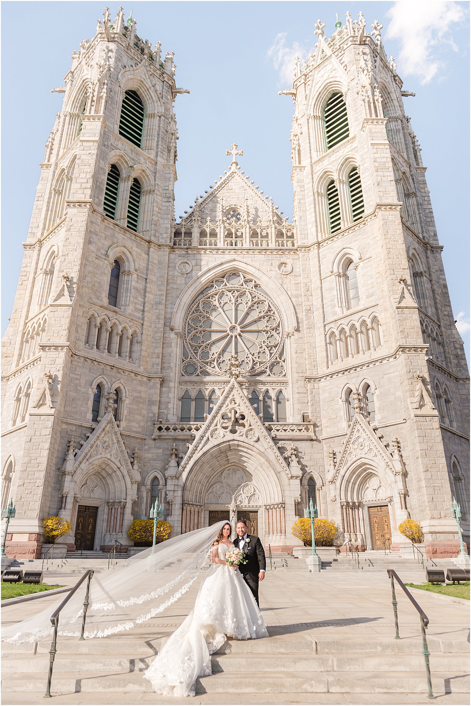 bride and groom kiss outside the Cathedral Basilica of the Sacred Heart