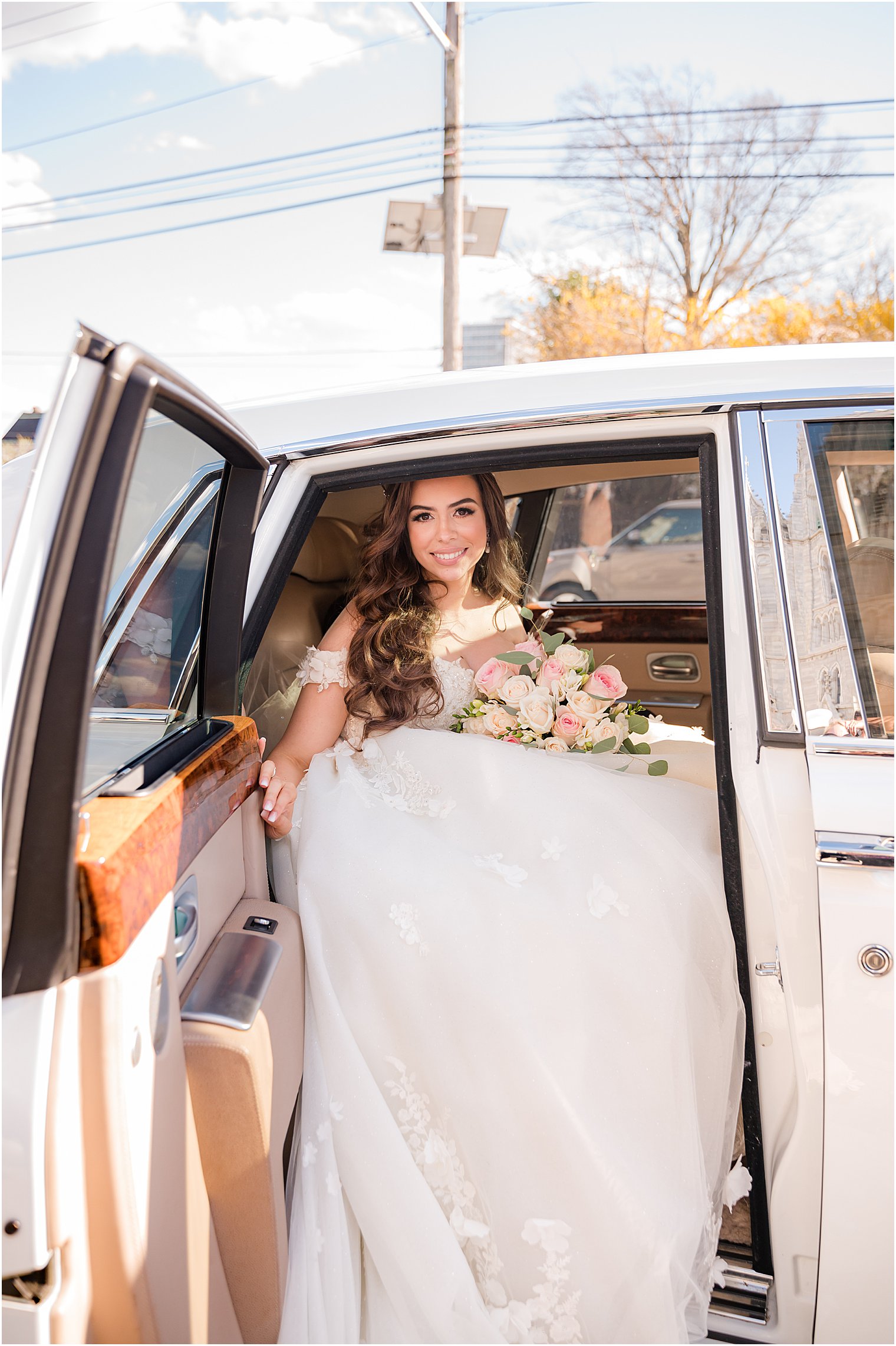 bride gets into classic car after portraits 