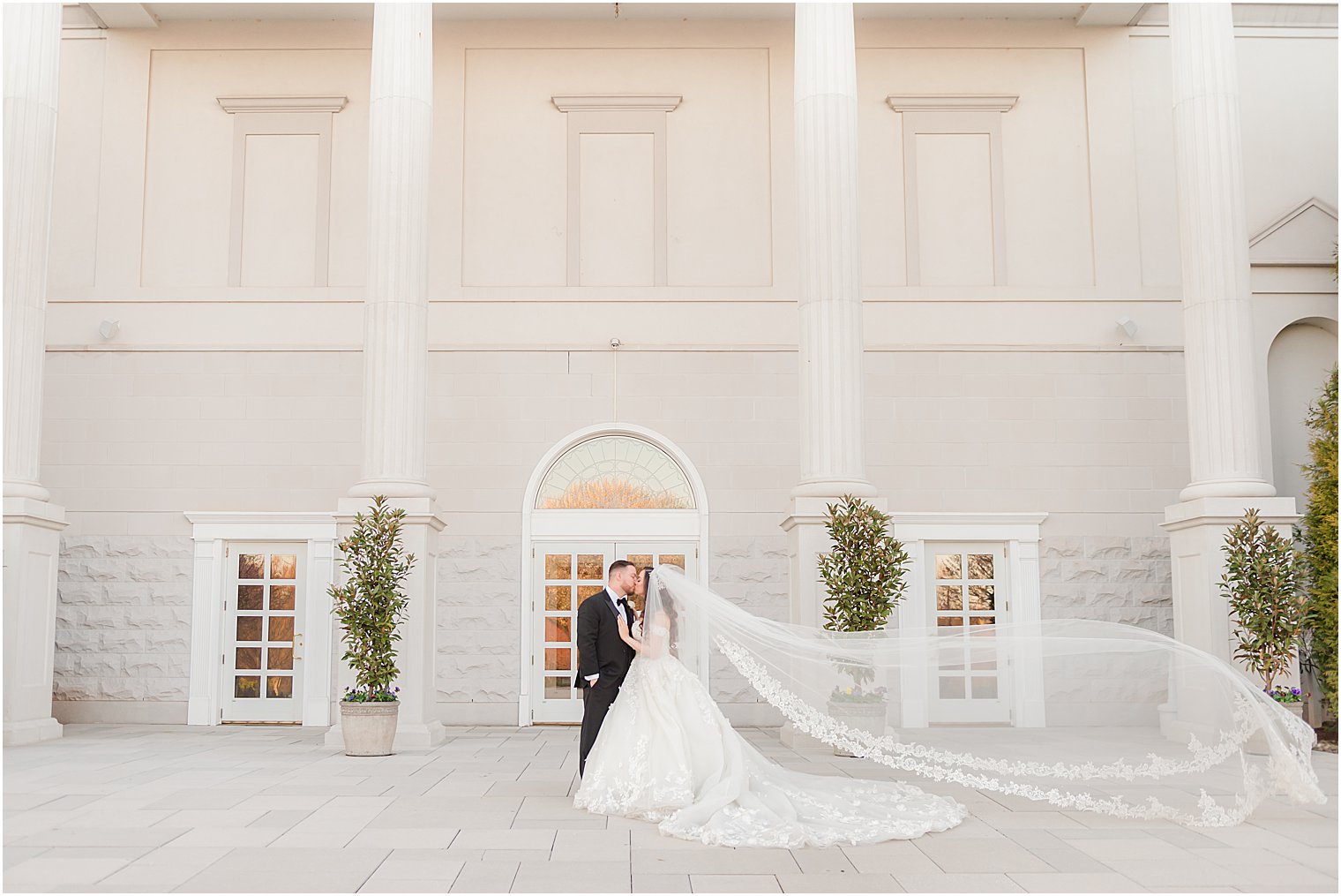 newlyweds pose outside of The Palace at Somerset Park