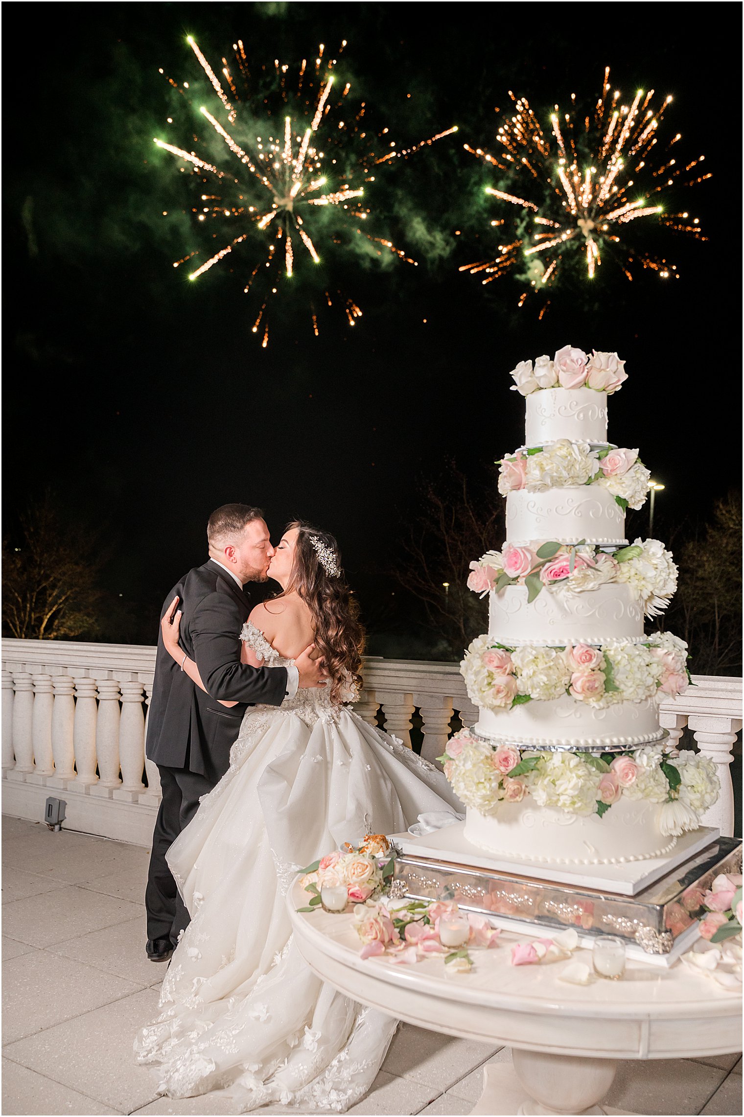 couple kisses during fireworks display at The Palace at Somerset Park