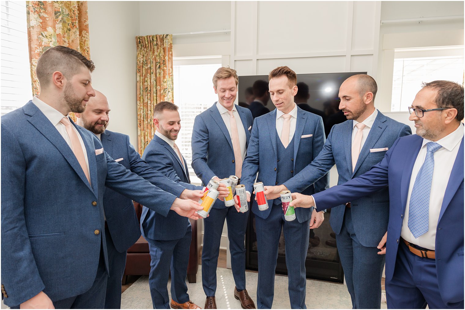 groomsmen toasting at Renault Winery in Egg Harbor Township, NJ