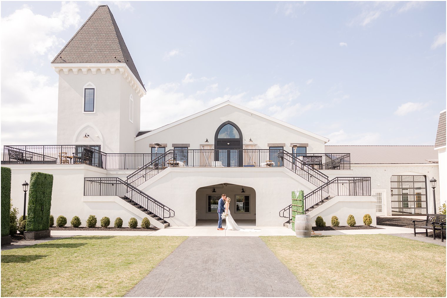 bride and groom in front of Vineyard Ballroom at Renault Winery in Egg Harbor Township, NJ