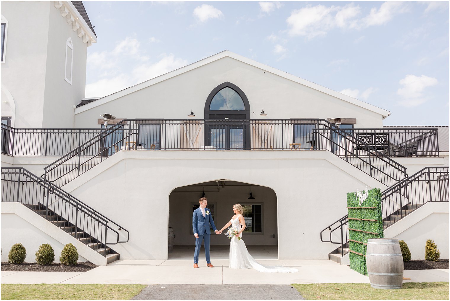bride and groom photos in front of Vineyard Ballroom at Renault Winery in Egg Harbor Township, NJ