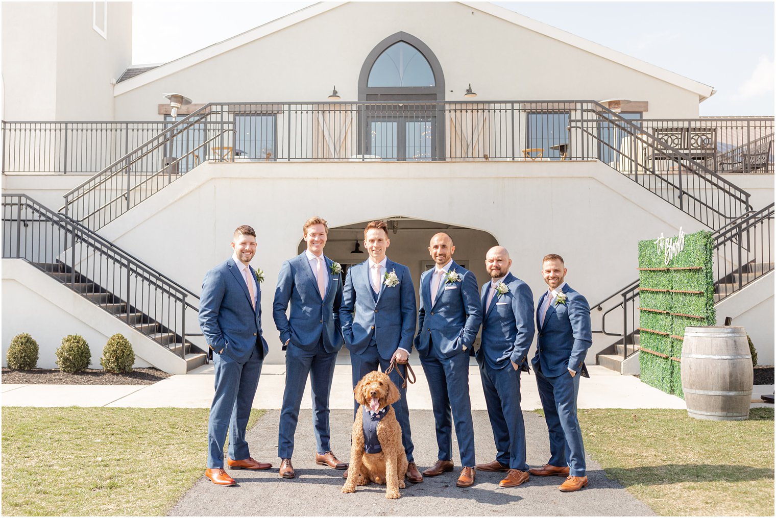 groomsmen with dog at Renault Winery in Egg Harbor Township, NJ