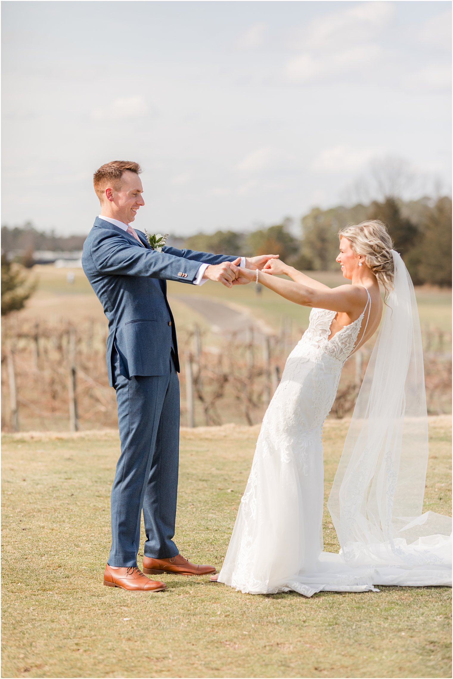 candid bride and groom photos in vineyard at Renault Winery in Egg Harbor Township, NJ