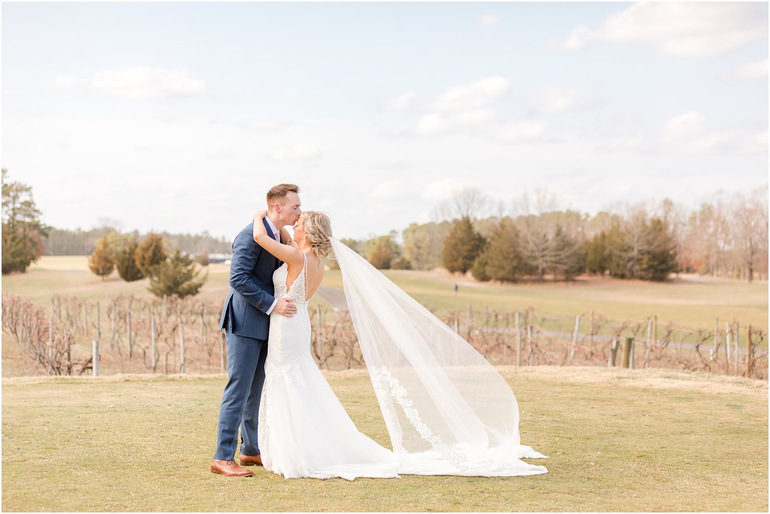 groom kisses bride's forehead