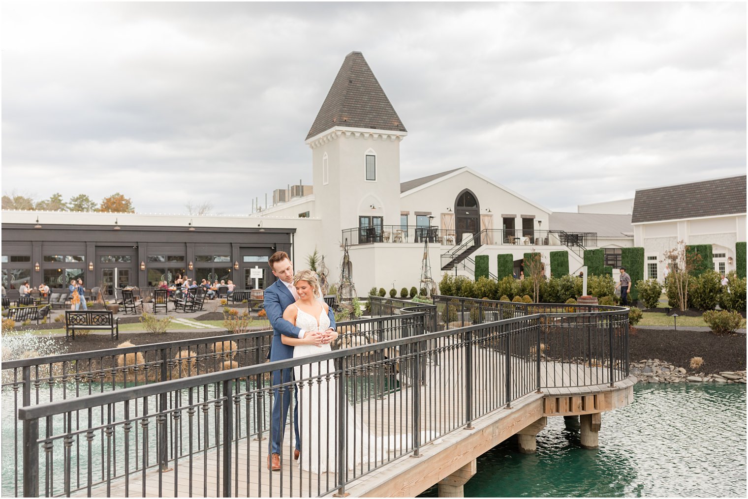 bride and groom in front of building at Renault Winery in Egg Harbor Township, NJ