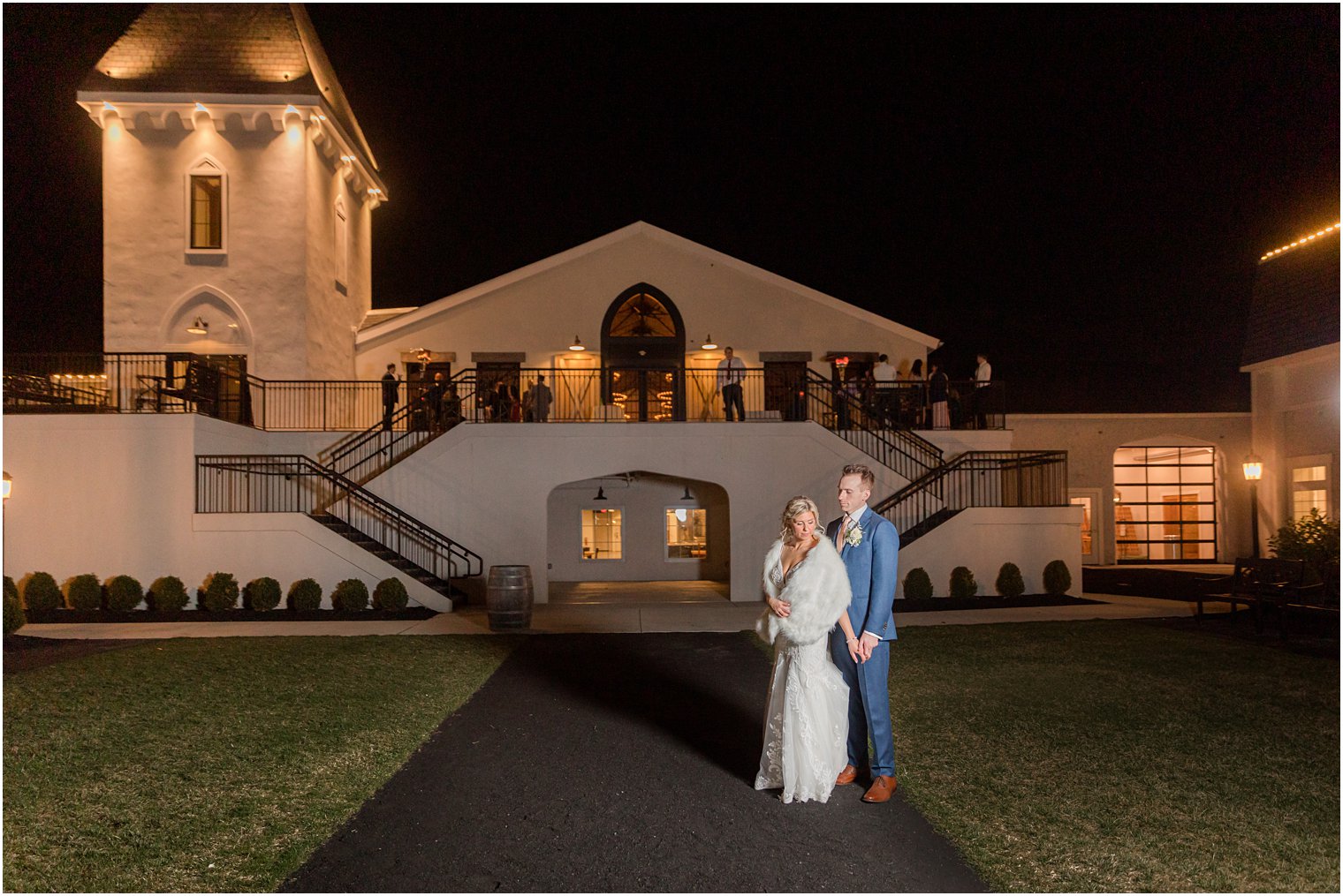 night photo of bride in groom at rustic wedding reception in Vineyard Ballroom at Renault Winery South Jersey Venue in Egg Harbor Township NJ