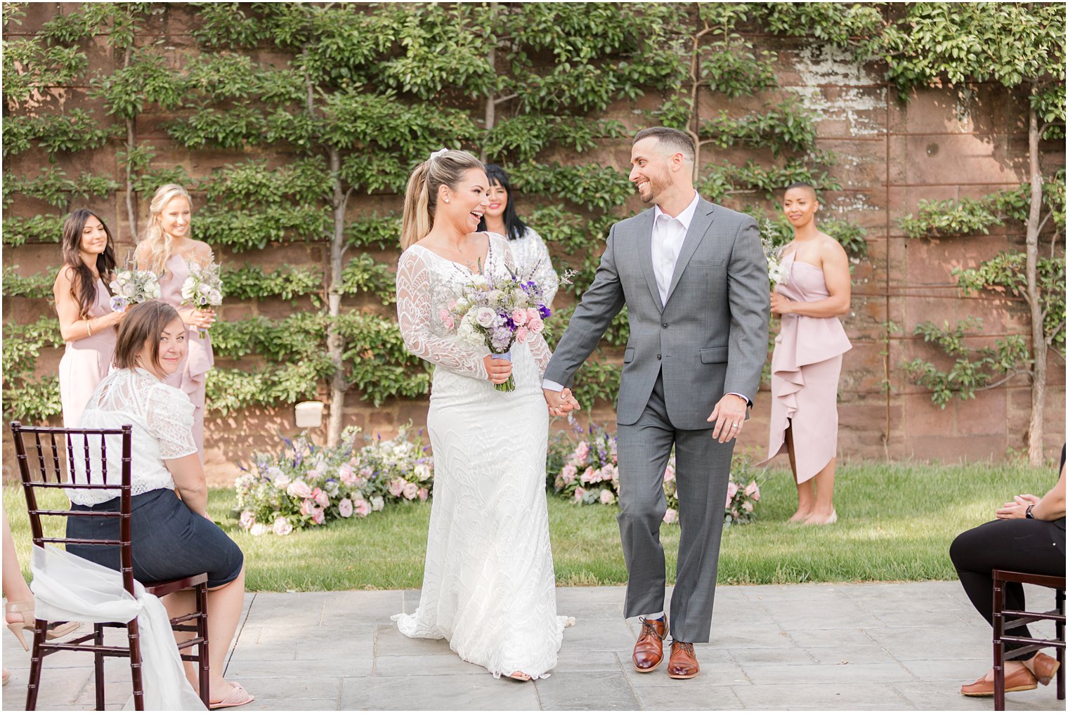 bride and groom laugh together during Croatian inspired minimony at Tyler Gardens