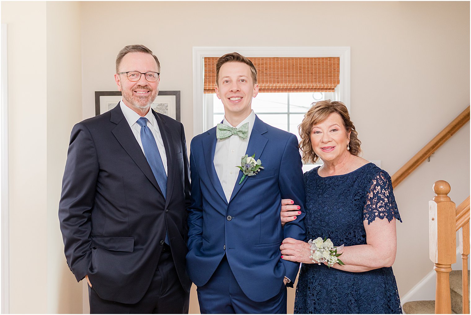 mom and dad pose with groom before Belmar Fishing Club wedding