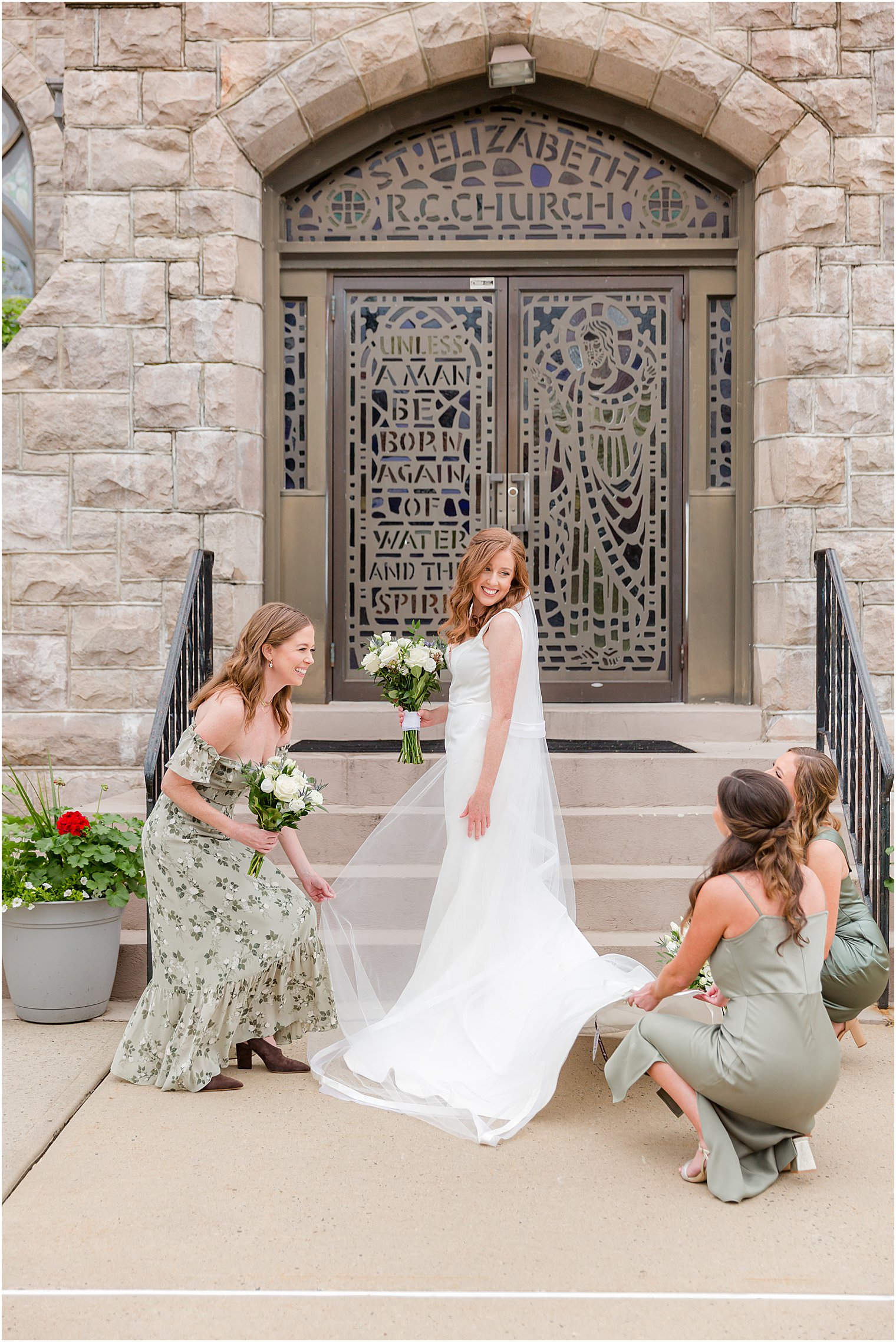 bride stands outside church with bridesmaids 