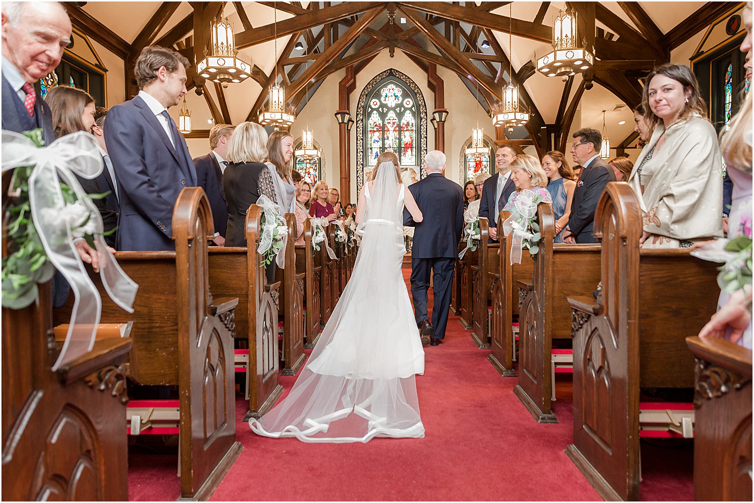 bride walks down aisle at Avon-by-the-Sea with dad