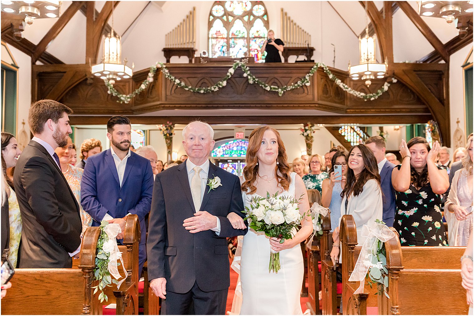 bride enters ceremony with dad at Avon-by-the-Sea