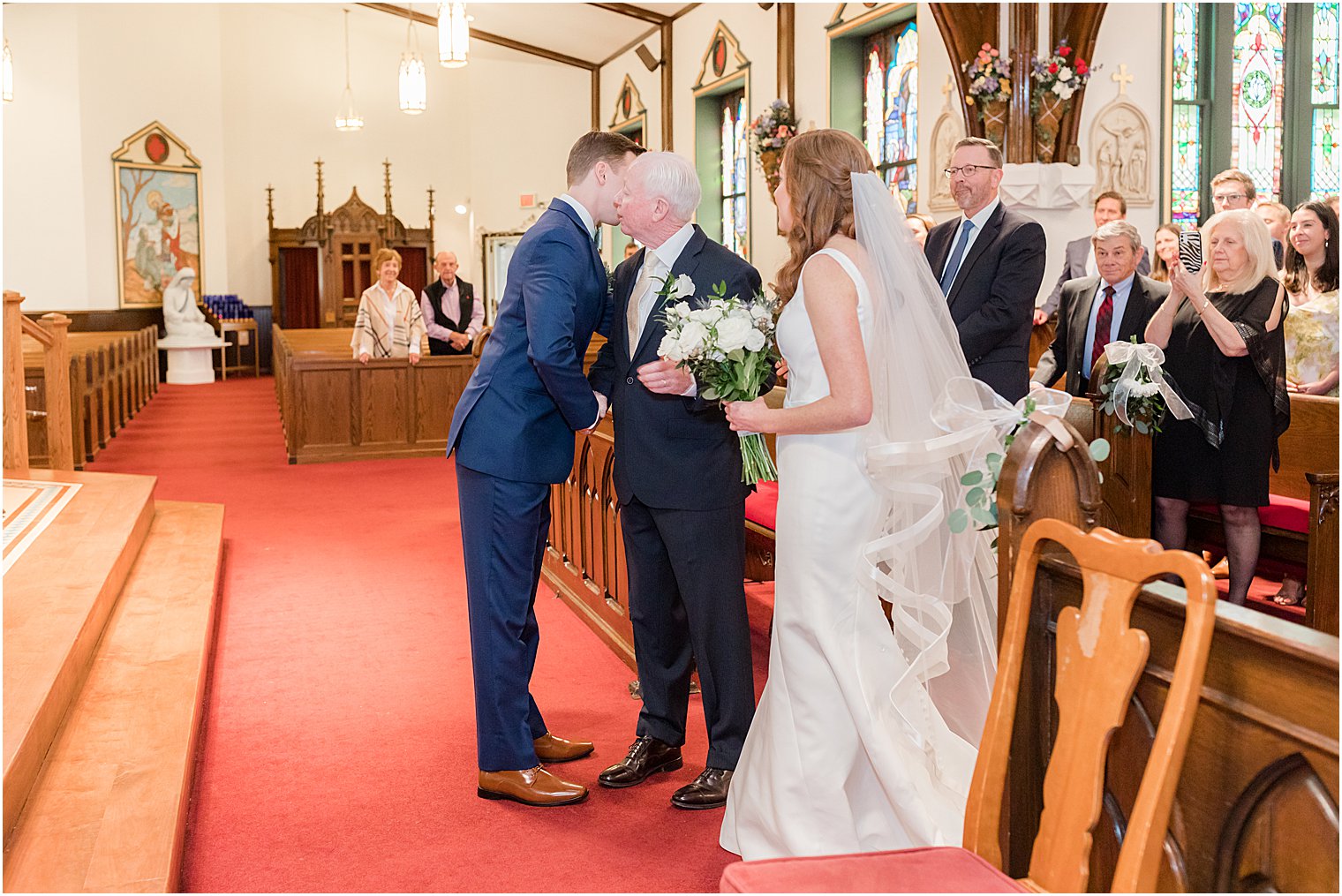 dad hugs groom while giving bride away at Avon-by-the-Sea