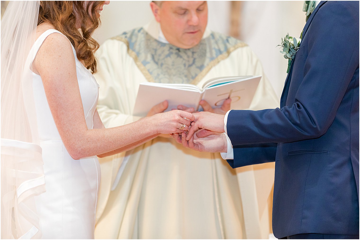 couple holds hands during traditional church ceremony at Avon-by-the-Sea