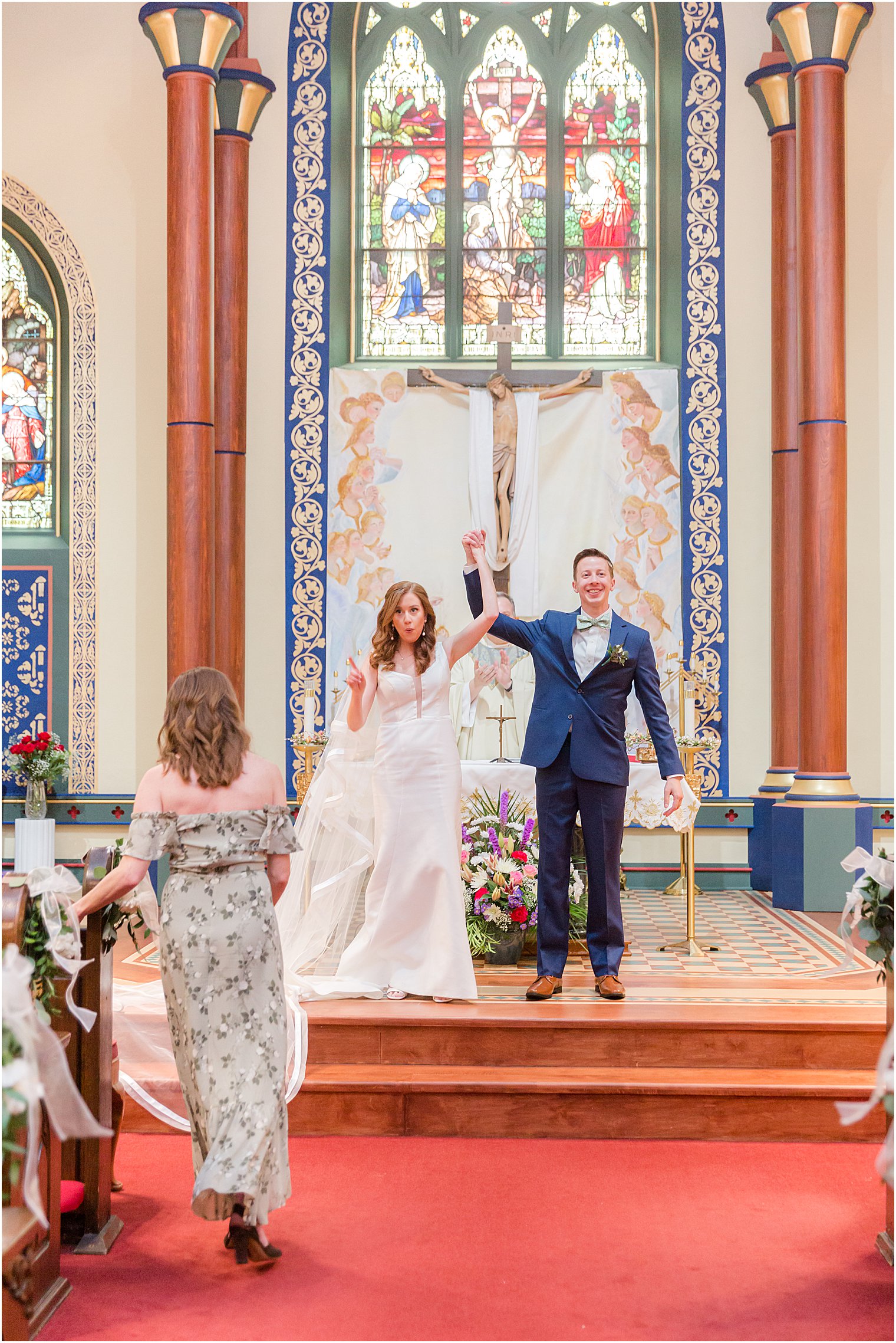 bride and groom cheer after ceremony