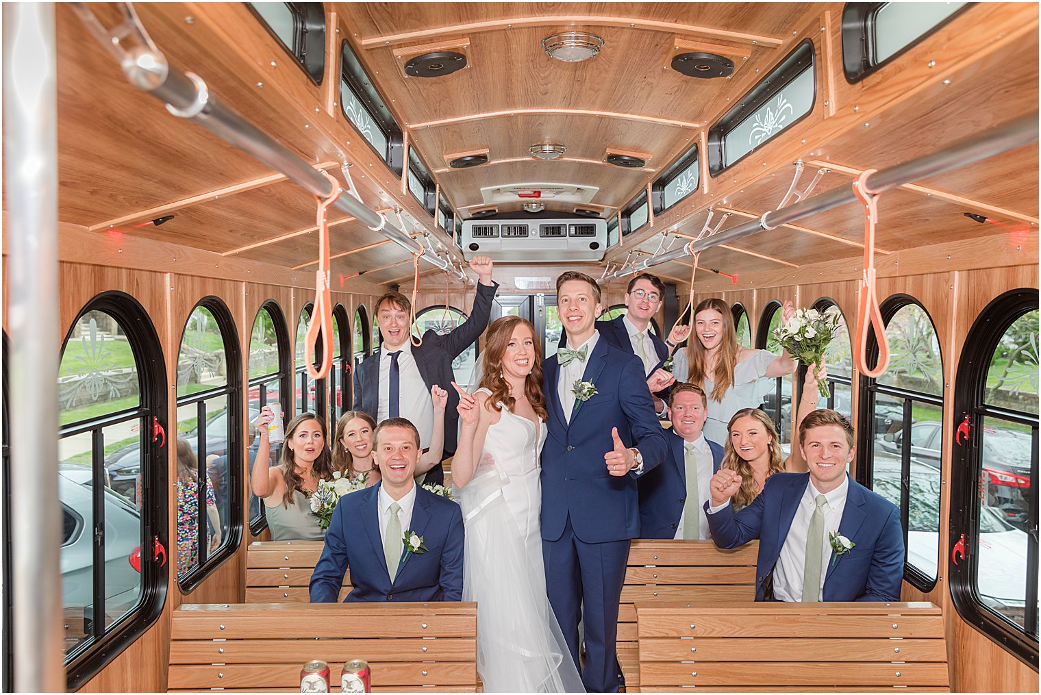 couple poses on trolley during NJ wedding photos