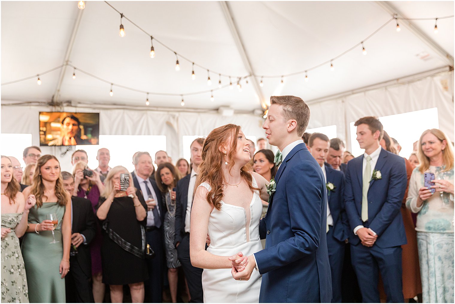 groom twirls bride during first dance