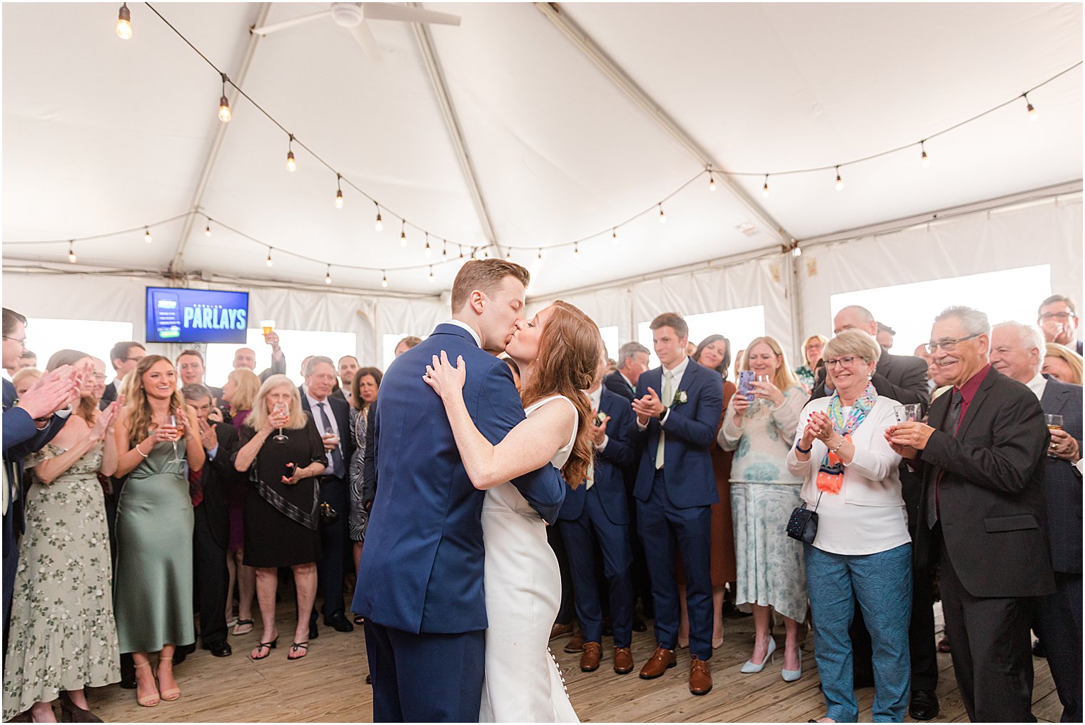 newlyweds kiss during first dance