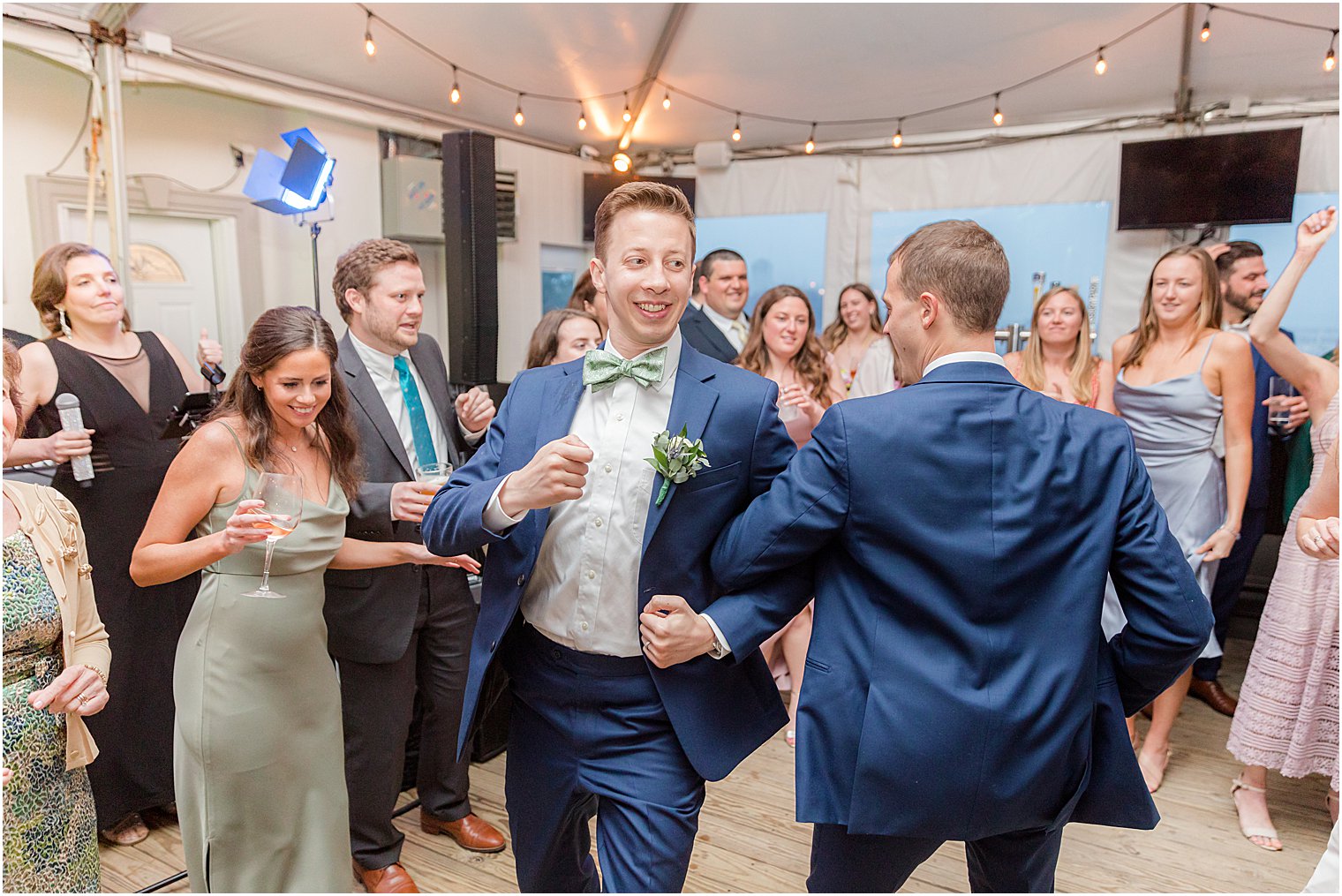 groom dances with guests at Belmar NJ wedding reception