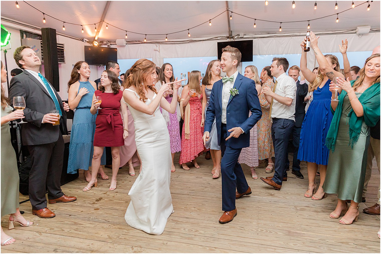 bride and groom dance with guests at Belmar NJ wedding reception