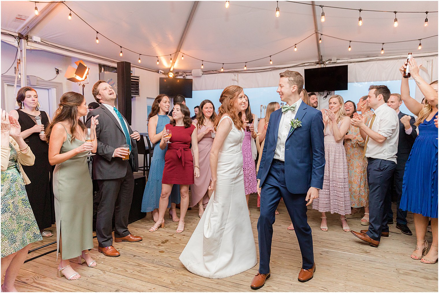 bride and groom dance with guests at Belmar NJ wedding reception