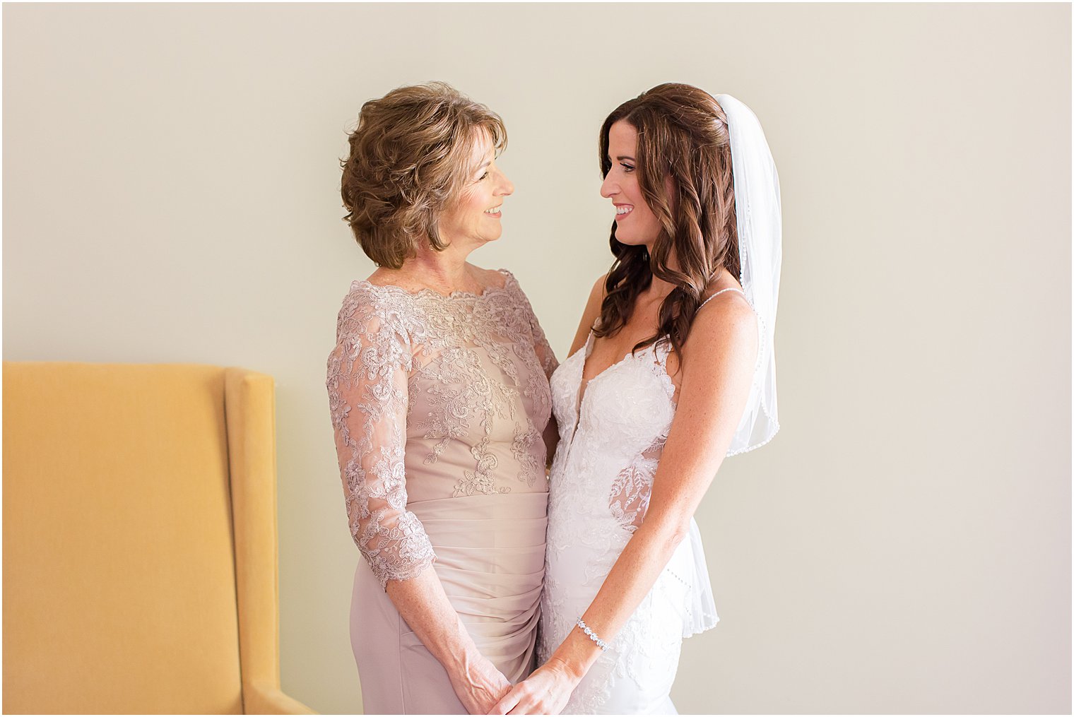 bride and mom getting ready for wedding